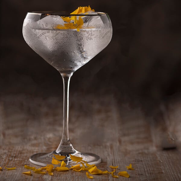 Artist edition perfect serve in a coupe glass garnished with orange peel