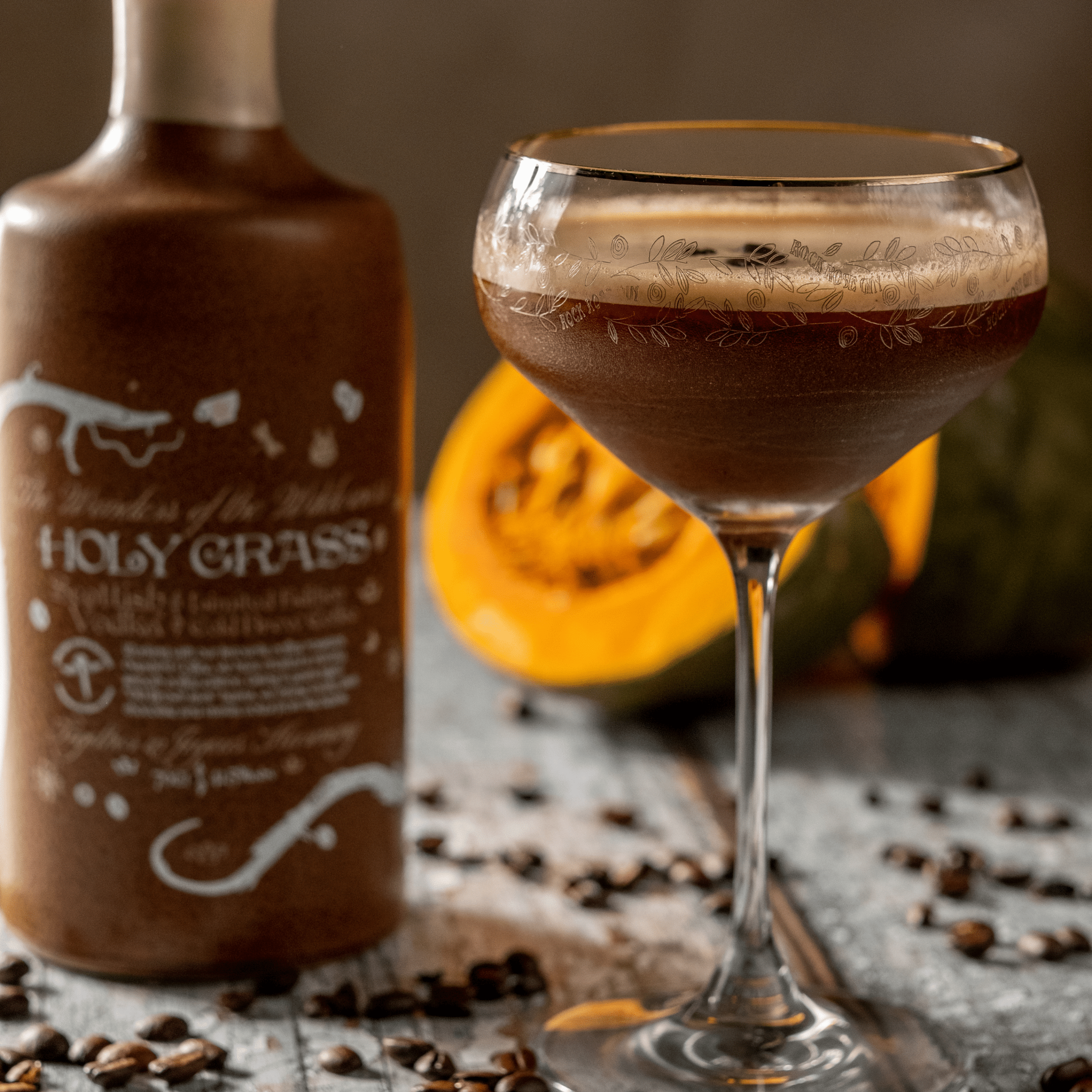 Bottle of Holy Grass Vodka Cold Brew Coffee Edition and Pumpkin Espresso Martini cocktail served in a coupe glass and garnish with coffee seeds